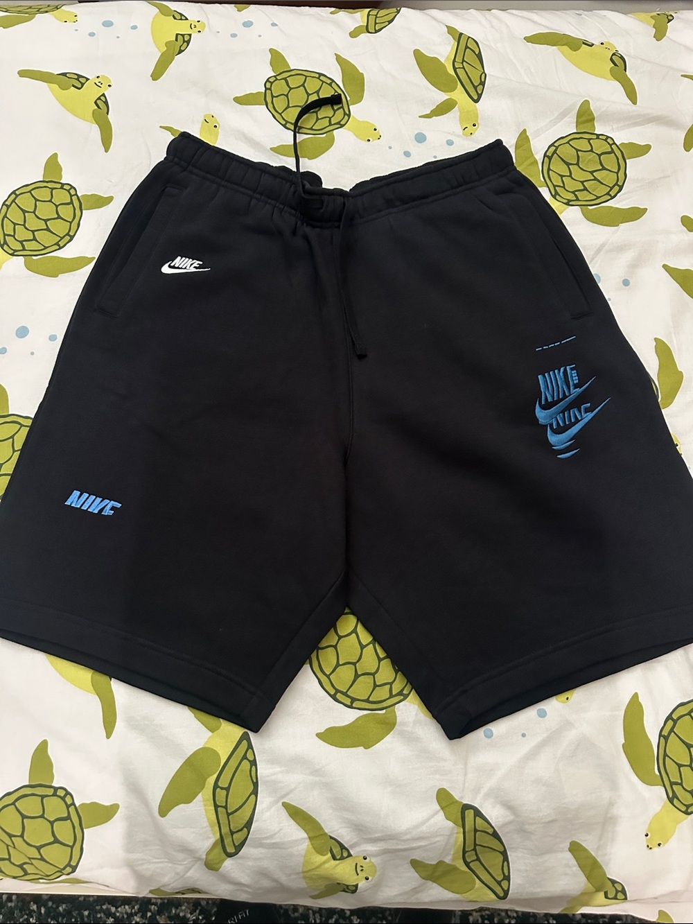 Nike Men’s Black Athletic Shorts with Blue Logos